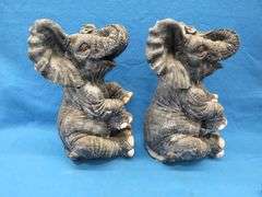 Pair of plaster elephants named Larry and Ryan.  Some small nicks.