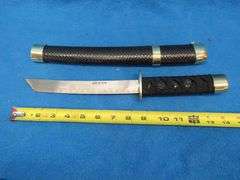 Three-sword set with scabbards and display stand