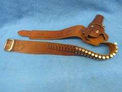 Hunter brand leather ammo belt with a Hunter brand holster.  Approx. 34".  Used with the gun in lot 
