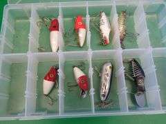 Eight Heddon Baits and a bait box, including River Runts, Midget Digits, and a Torpedo-style bait fr