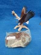 Four porcelain eagles.  Two are in their original boxes.