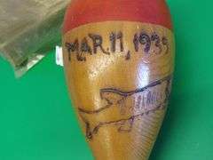 Hand carved wooden bobber and a vintage package of Deep Sea Hand Line