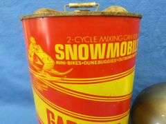 Vintage snowmobile Stancan 6.5 gallon steel gas can and a 6 7/8-7" Bell helmet.