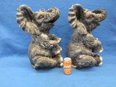 Pair of plaster elephants named Larry and Ryan.  Some small nicks.
