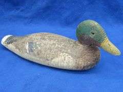 Vintage wooden duck decoy with glass eyes