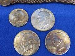 30 clad Kennedy halves and three Eisenhower dollars