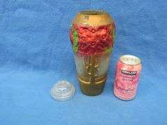Two working music box/powder boxes and a painted glass vase/urn with lid