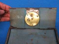 Four clocks for parts or repair.[ The large rectangular clock and the small round brass clock are Lu
