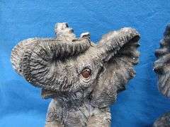 Pair of plaster elephants named Larry and Ryan.  Some small nicks.