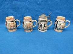 Three beer mugs and one stein