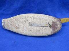 Vintage wooden duck decoy with glass eyes