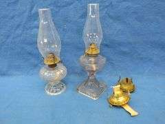 Two kerosene lamps with shades and two extra burners