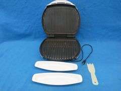 George Foreman grill including scraper and two drip trays also 18 wrapped clothes hangers with 12 pa