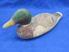 Vintage wooden duck decoy with glass eyes