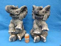 Pair of plaster elephants named Larry and Ryan.  Some small nicks.