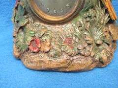 Lux wood and plaster painted parrot clock.  Movement works but hands don't move.