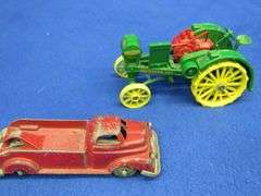 Small-scale die-cast John Deere Waterloo Boy tractor and an old metal tow truck