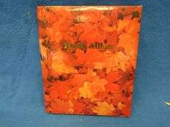Two scrapbooks filled with postcards, greeting cards. tobacco cards, and more