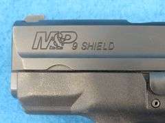 Smith and Wesson MP9 Shield 9mm semi-auto pistol.  SN HAP2821.  Includes two magazines and a molded 