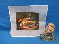 Completed cross stitch and a vintage rubber "Old Ironsides" door stop.