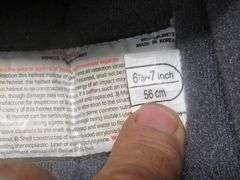 Vintage snowmobile Stancan 6.5 gallon steel gas can and a 6 7/8-7" Bell helmet.