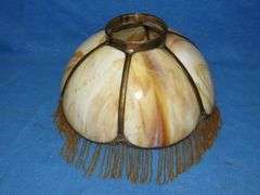 14" caramel slag glass shade with beaded fringe.  Very good condition.