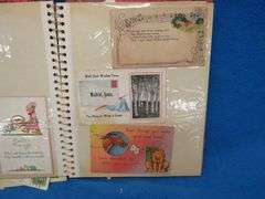 Two scrapbooks filled with postcards, greeting cards. tobacco cards, and more