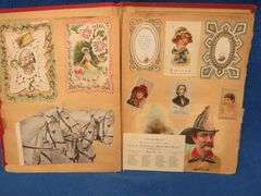 Two scrapbooks filled with postcards, greeting cards. tobacco cards, and more
