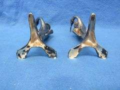 Pair of Art Nouveau era figural candlesticks.  Unknown composition.  Marked W. B. Mfg. Co. 1110.