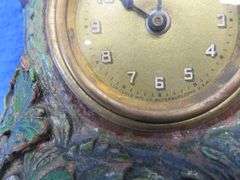 Lux wood and plaster painted parrot clock.  Movement works but hands don't move.