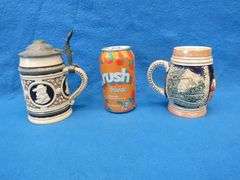 Three beer mugs and one stein