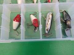 Eight Heddon Baits and a bait box, including River Runts, Midget Digits, and a Torpedo-style bait fr
