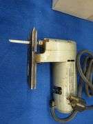 Vintage sabre saw and sander, battery charger, and more