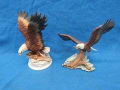 Four porcelain eagles.  Two are in their original boxes.