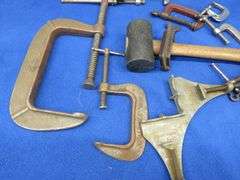 Different sized C-clamps and a rubber mallet