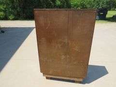 Two door free standing bookcase with beveled glass and lower storage area.  56" x 36" x 11"