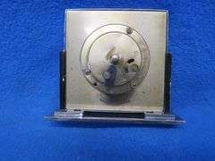 Four clocks for parts or repair.[ The large rectangular clock and the small round brass clock are Lu