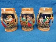Three beer mugs and one stein