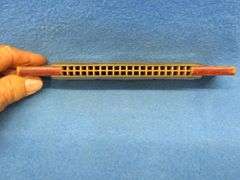 Hohner 40-hole double-sided tremolo harmonica.  Sounds great.