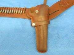 Hunter brand leather ammo belt with a Hunter brand holster.  Approx. 34".  Used with the gun in lot 