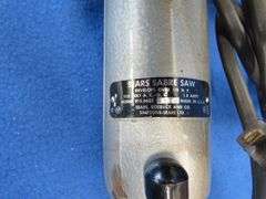 Vintage sabre saw and sander, battery charger, and more