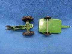 Two toy tractors.  Minneapolis Moline with a trailer and a John Deere.