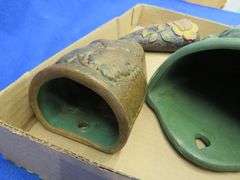 Three pottery wall pockets