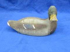 Vintage wooden duck decoy with glass eyes