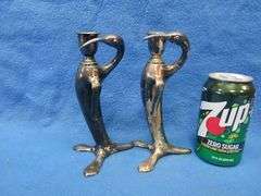 Pair of Art Nouveau era figural candlesticks.  Unknown composition.  Marked W. B. Mfg. Co. 1110.