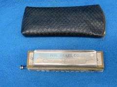 Wm. Kratt Super "48" chromatic harmonica with a soft case
