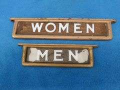 Vintage glass restroom signs in cast iron frames