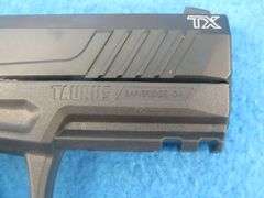 Taurus TX22 .22LR semi-auto pistol.  SN 1PT329299.  Includes one magazine, manual, and original box.