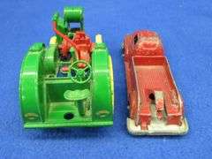 Small-scale die-cast John Deere Waterloo Boy tractor and an old metal tow truck