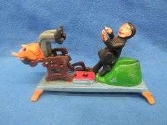 Large copper mug, small office lamp, and a dental-themed mechanical bank from Taiwan